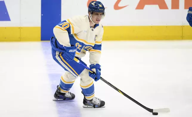 St. Louis Blues center Brayden Schenn (10) skates with the puck during the third period of an NHL hockey game against the Washington Capitals, Thursday, Feb. 27, 2025, in Washington. (AP Photo/Nick Wass)