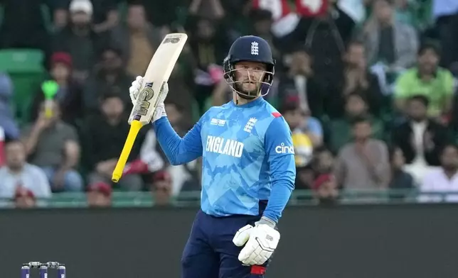 England's Ben Duckett celebrates after completing 150 runs during the ICC Champions Trophy cricket match between Australia and England, in Lahore, Pakistan, Saturday, Feb. 22, 2025. (AP Photo/K.M. Chaudary)