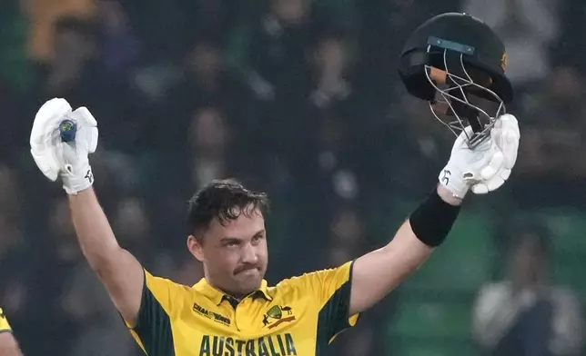 Australia's Josh Inglis celebrates after scoring century during the ICC Champions Trophy cricket match between Australia and England, in Lahore, Pakistan, Saturday, Feb. 22, 2025. (AP Photo/K.M. Chaudary)