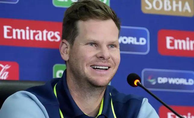 Australia's Steve Smith smiles during a press conference regarding their ICC Champions Trophy cricket match against Australia, in Lahore, Pakistan, Friday, Feb. 21, 2025. (AP Photo/K.M Chaudary)