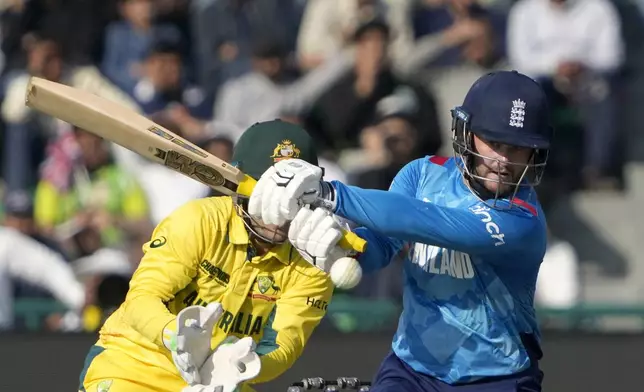 England's Ben Duckett plays a shot during the ICC Champions Trophy cricket match between Australia and England, in Lahore, Pakistan, Saturday, Feb. 22, 2025. (AP Photo/K.M. Chaudary)