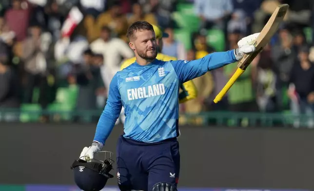 England's Ben Duckett celebrates after scoring century during the ICC Champions Trophy cricket match between Australia and England, in Lahore, Pakistan, Saturday, Feb. 22, 2025. (AP Photo/K.M. Chaudary)