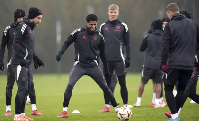 Manchester United's Marcus Rashford, center, during a training session in Manchester, England, Wednesday, Jan. 22, 2025, ahead of the Europa League soccer match between Manchester United and Rangers FC. (Martin Rickett/PA via AP)
