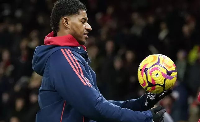 FILE - Manchester United's Marcus Rashford holds the ball during the warm up before the English Premier League soccer match between Manchester United and Newcastle at the Old Trafford stadium in Manchester, England, on Dec. 30, 2024. (AP Photo/Dave Thompson, File)