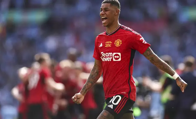 FILE - Manchester United's Marcus Rashford celebrates after his team won the English FA Cup final soccer match between Manchester City and Manchester United at Wembley Stadium in London, on May 25, 2024. (AP Photo/Ian Walton, File)