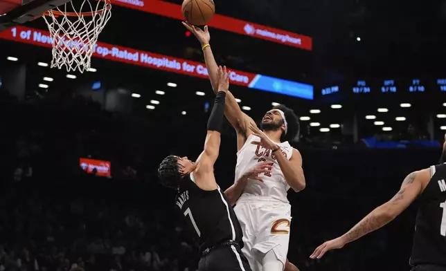 Cleveland Cavaliers' Jarrett Allen (31) shoots over Brooklyn Nets' Killian Hayes (7) during the first half of an NBA basketball game Thursday, Feb. 20, 2025, in New York. (AP Photo/Frank Franklin II)