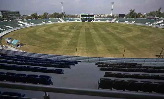 A view of Rawalpindi Cricket Stadium where workers give final touches of arrangements in in preparation for upcoming ICC Champions Trophy 2025, in Rawalpindi, Pakistan, Sunday, Feb. 16, 2025. (AP Photo/Anjum Naveed)