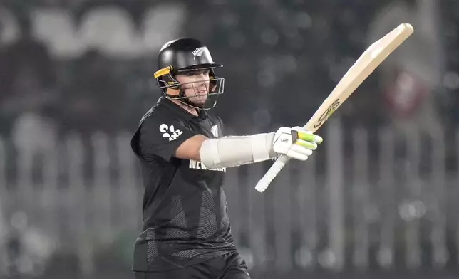 New Zealand's Tom Latham celebrates after scoring fifty during the ICC Champions Trophy cricket match between Bangladesh and New Zealand, in Rawalpindi, Pakistan Monday, Feb. 24, 2025,. (AP Photo/Anjum Naveed)
