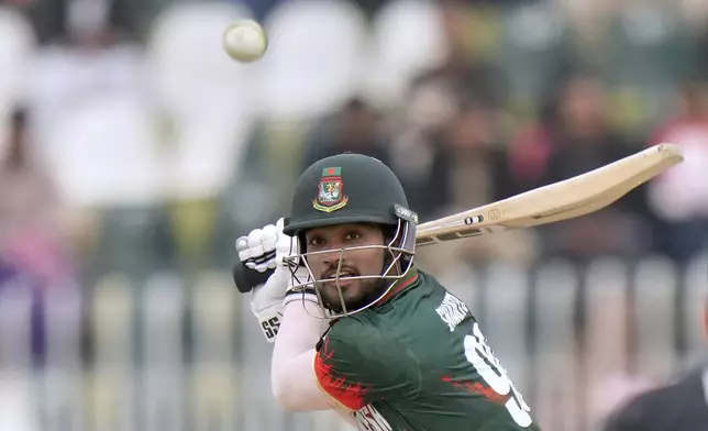 Bangladesh's Najmul Hossain Shanto plays a shot during the ICC Champions Trophy cricket match between Bangladesh and New Zealand, in Rawalpindi, Pakistan Monday, Feb. 24, 2025,. (AP Photo/Anjum Naveed)