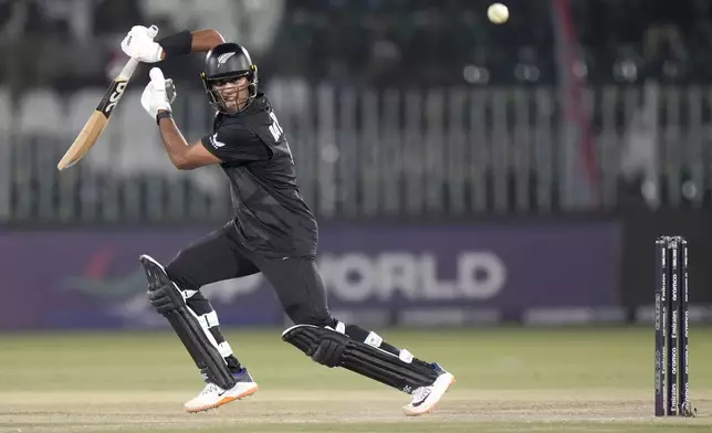 New Zealand's Rachin Ravindra plays a shot during the ICC Champions Trophy cricket match between Bangladesh and New Zealand, in Rawalpindi, Pakistan Monday, Feb. 24, 2025,. (AP Photo/Anjum Naveed)