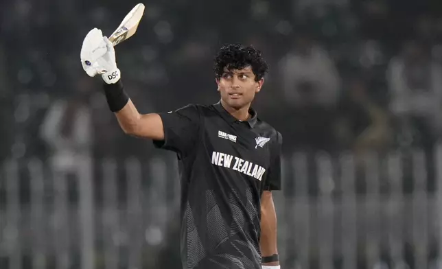 New Zealand's Rachin Ravindra celebrates after scoring century during the ICC Champions Trophy cricket match between Bangladesh and New Zealand, in Rawalpindi, Pakistan Monday, Feb. 24, 2025,. (AP Photo/Anjum Naveed)