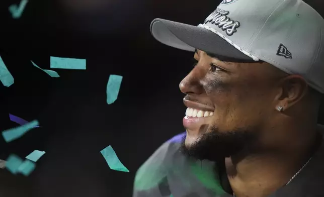 Philadelphia Eagles running back Saquon Barkley smiles after the NFL Super Bowl 59 football game against the Kansas City Chiefs, Sunday, Feb. 9, 2025, in New Orleans. (AP Photo/Frank Franklin II)