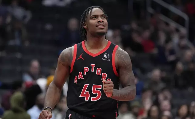 Toronto Raptors guard Davion Mitchell celebrates after making a defensive play against the Washington Wizards during the second half of an NBA basketball game Wednesday, Jan. 29, 2025, in Washington. (AP Photo/Jess Rapfogel)