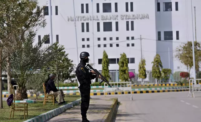 Police officers stand guard to ensure security outside the National Bank Stadium, where final preparations are going on for upcoming ICC Champions Trophy 2025, in Karachi, Pakistan, Sunday, Feb. 16, 2025. (AP Photo/Fareed Khan)