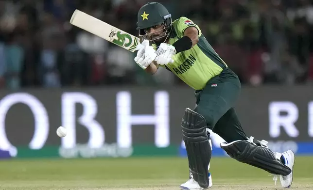 Pakistan's Babar Azam plays a shot during the ICC Champions Trophy cricket match between Pakistan and New Zealand, in Karachi, Pakistan Wednesday, Feb. 19, 2025. (AP Photo/Anjum Naveed)