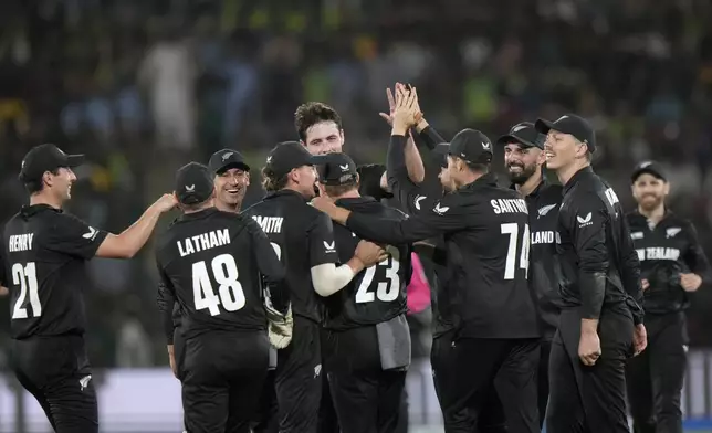 New Zealand's Will O' Rourke, center, celebrates with teammates after the dismissal of Pakistan's Mohammad Rizwan during the ICC Champions Trophy cricket match between Pakistan and New Zealand, in Karachi, Pakistan Wednesday, Feb. 19, 2025. (AP Photo/Anjum Naveed)