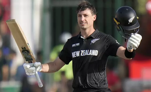 New Zealand's Will Young celebrates after scoring century during the ICC Champions Trophy cricket match between Pakistan and New Zealand, in Karachi, Pakistan Wednesday, Feb. 19, 2025. (AP Photo/Anjum Naveed)