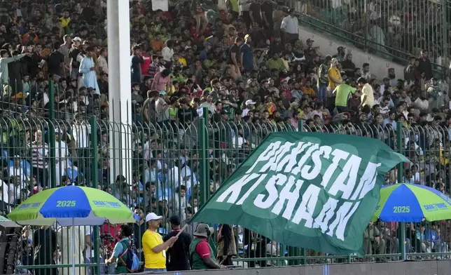 Fans cheer during the ICC Champions Trophy cricket match between Pakistan and New Zealand, in Karachi, Pakistan Wednesday, Feb. 19, 2025. (AP Photo/Fareed Khan)