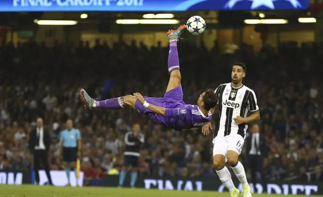 FILE - Real Madrid's Cristiano Ronaldo connects with an overhead kick during the Champions League final soccer match between Juventus and Real Madrid at the Millennium stadium in Cardiff, Wales Saturday June 3, 2017. (AP Photo/Dave Thompson, File)