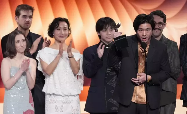 Arielle Zakowski, from left, Samuel Davis, Joan Chen, , Izac Wang, Sean Wang, and Carlos Lopez Estrada accept the best first feature award for "Didi" during the Film Independent Spirit Awards on Saturday, Feb. 22, 2025, in Santa Monica, Calif. (AP Photo/Chris Pizzello)