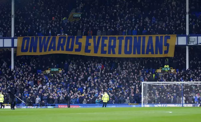 Everton fans holding banners in the stands before the English FA Cup fourth round soccer match between Everton and Bournemouth at at Goodison Park, Liverpool, England, Saturday, Feb. 8, 2025. (Peter Byrne/PA via AP)