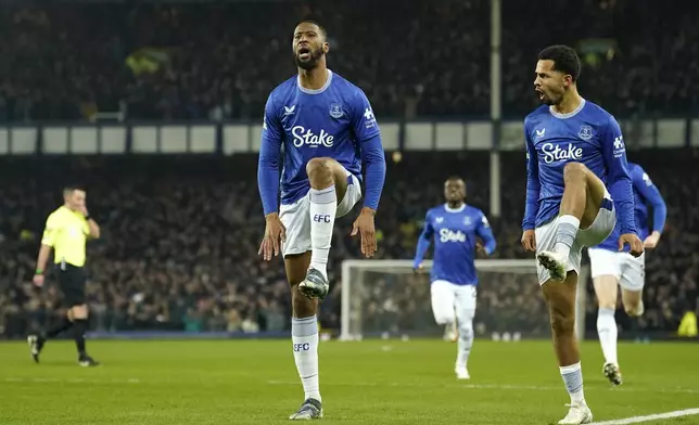 Everton's Beto, centre, celebrates with teammates after scoring his side's opening goal during the English Premier League soccer match between Everton and Liverpool, Liverpool, England, Wednesday, Feb.12, 2025. (AP Photo/Dave Thompson)