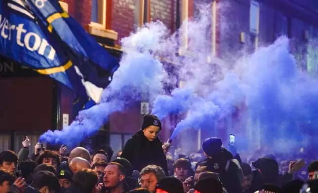 Everton fans ahead the English Premier League soccer match between Everton and Liverpool, Liverpool, England, Wednesday, Feb.12, 2025. (AP Photo/Dave Thompson)