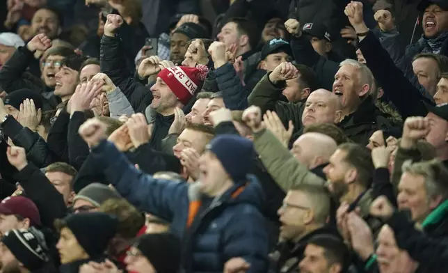 Soccer fans react during the English Premier League soccer match between Everton and Liverpool, Liverpool, England, Wednesday, Feb.12, 2025. (AP Photo/Dave Thompson)