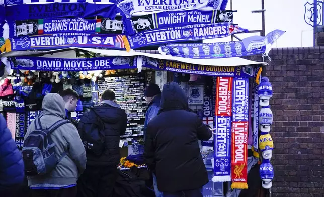 Fans outside of the Goodison Park stadium ahead of the English Premier League soccer match between Everton and Liverpool in Liverpool, England, Wednesday, Feb.12, 2025. (AP Photo/Dave Thompson)