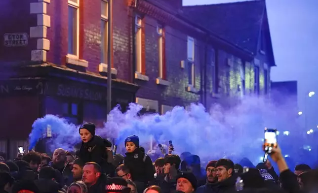 Everton fans ahead the English Premier League soccer match between Everton and Liverpool, Liverpool, England, Wednesday, Feb.12, 2025. (AP Photo/Dave Thompson)