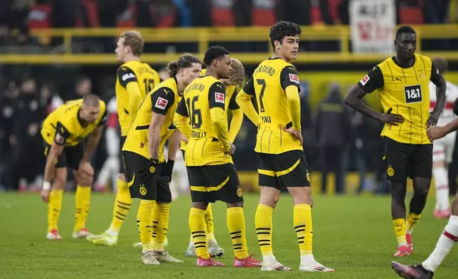 Dortmund players stand on the pitch at the end of the German Bundesliga soccer match between Borussia Dortmund and VfB Stuttgart at the Signal-Iduna Park in Dortmund, Germany, Saturday, Feb. 8, 2025. (AP Photo/Martin Meissner)