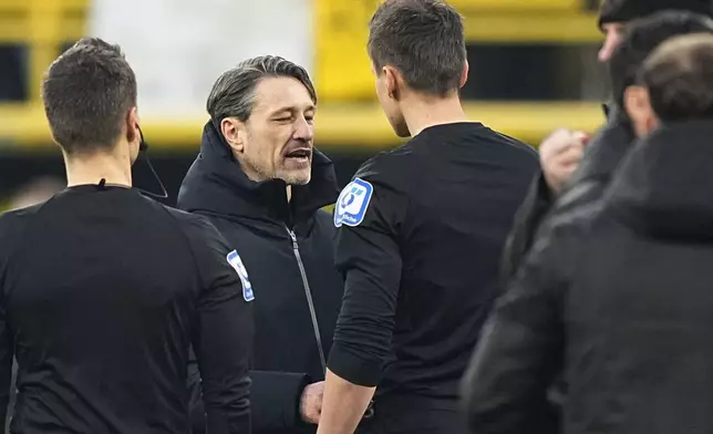 Dortmund's head coach Nico Kovac argues with referee Daniel Siebert at the end of the German Bundesliga soccer match between Borussia Dortmund and VfB Stuttgart at the Signal-Iduna Park in Dortmund, Germany, Saturday, Feb. 8, 2025. (AP Photo/Martin Meissner)