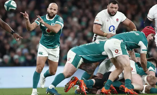 Ireland's Jamison Gibson-Park passes the ball during the Six Nations rugby union match between Ireland and England at the Aviva Stadium in Dublin, Saturday, Feb. 1, 2025. (AP Photo/Peter Morrison)