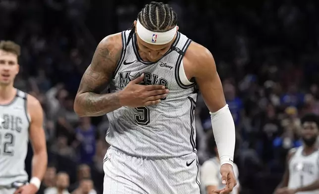 Orlando Magic forward Paolo Banchero (5) reacts after making the game winning shot in the closing moments of an NBA basketball game against the San Antonio Spurs Saturday, Feb. 8, 2025, in Orlando, Fla. (AP Photo/John Raoux)
