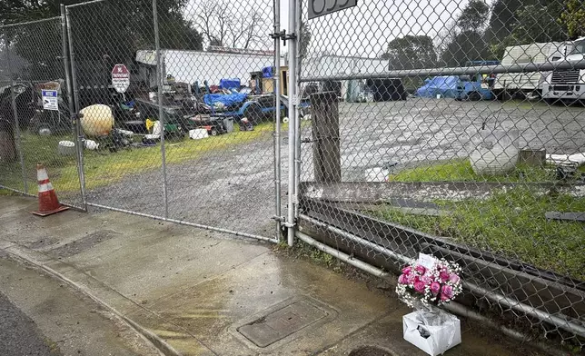 Flowers sit outside the property where San Francisco Bay Area prosecutors say Maximilian Snyder killed landlord Curtis Lind in Vallejo, California, Friday, Jan. 31, 2025. (AP Photo/Janie Har)