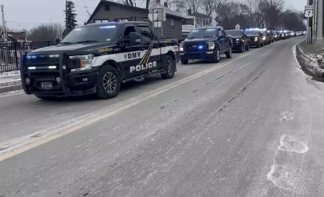 FILE - Law enforcement follow a hearse carrying fallen border patrol agent David Maland from the UVM Medical Center morgue to a funeral home in Burlington, Vt., Thursday, Jan. 23, 2025. (WCAX via AP, File)
