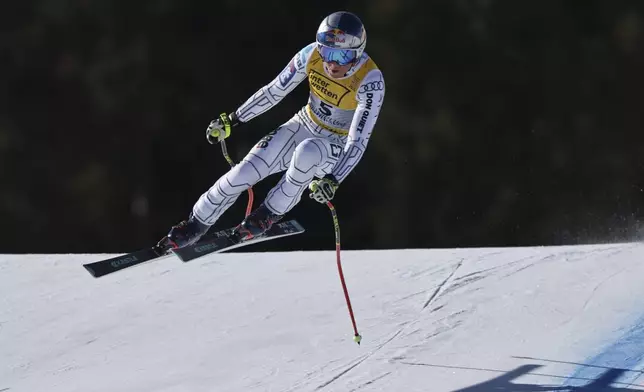 Czech Republic's Ester Ledecka speeds down the course during a women's downhill race, at the Alpine Ski World Championships, in Saalbach-Hinterglemm, Austria, Saturday, Feb. 8, 2025. (AP Photo/Marco Trovati)