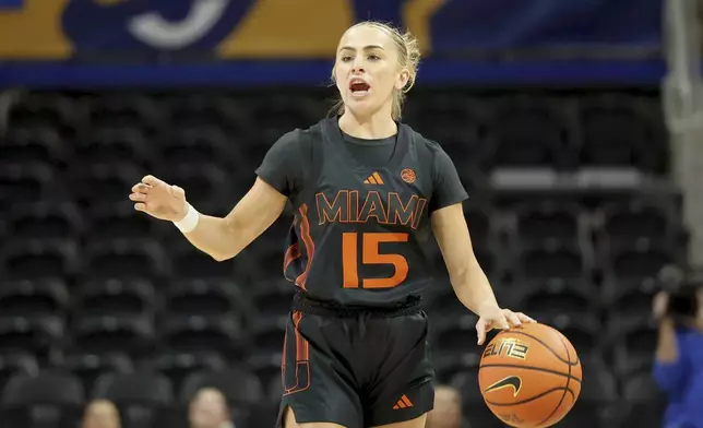 FILE - Miami's Hanna Cavinder (15) dribbles during an NCAA basketball game against Pittsburgh, Sunday, Dec. 15, 2024, in Pittsburgh. (AP Photo/Gregory Payan, File)