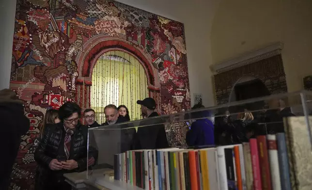 Art installations are displayed during the preview of the exhibition "En Route" organized by the Vatican Apostolic Library exploring world tours of the late 19th century at the Vatican, Friday, Jan. 31, 2025. (AP Photo/Gregorio Borgia)