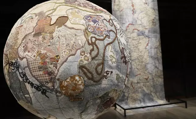Art installations are displayed during the preview of the exhibition "En Route" organized by the Vatican Apostolic Library exploring world tours of the late 19th century at the Vatican, Friday, Jan. 31, 2025. (AP Photo/Gregorio Borgia)