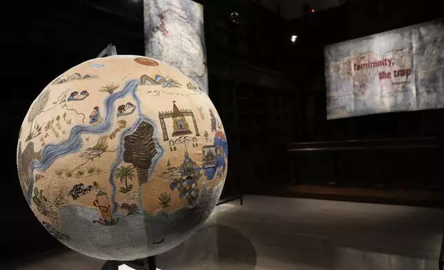 Art installations are displayed during the preview of the exhibition "En Route" organized by the Vatican Apostolic Library exploring world tours of the late 19th century at the Vatican, Friday, Jan. 31, 2025. (AP Photo/Gregorio Borgia)