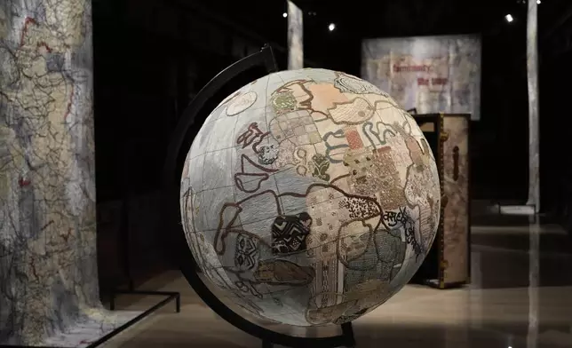 Art installations are displayed during the preview of the exhibition "En Route," organized by the Vatican Apostolic Library, which explores world tours of the late 19th century, at the Vatican on Friday, Jan. 31, 2025. (AP Photo/Gregorio Borgia)