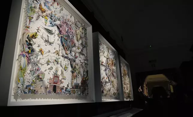 Art installations are displayed during the preview of the exhibition "En Route" organized by the Vatican Apostolic Library exploring world tours of the late 19th century at the Vatican, Friday, Jan. 31, 2025. (AP Photo/Gregorio Borgia)