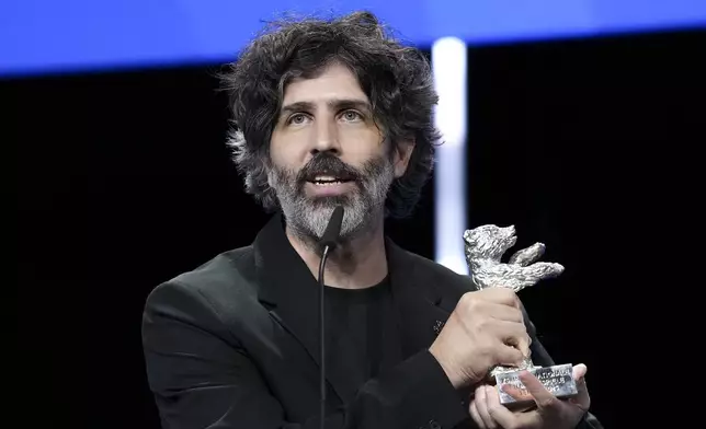 Ivan Fund accepts the Silver Bear jury prize for the film 'The Message' during the awards ceremony at the International Film Festival, Berlinale, in Berlin, Saturday, Feb. 22, 2025. (Photo by Scott A Garfitt/Invision/AP).