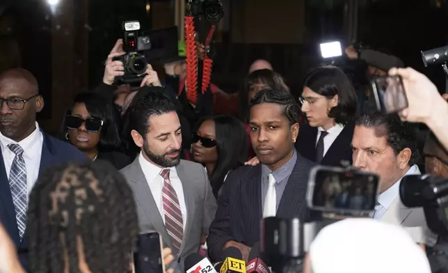 A$AP Rocky, center right, speaks next to attorney Chad Seigel after he was found not guilty in his trial Tuesday, Feb. 18, 2025, in Los Angeles. (AP Photo/Damian Dovarganes)
