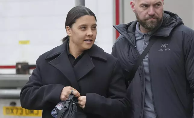 Australian football star, Chelsea striker Samantha Kerr arrives a court as she was charged with causing a police officer harassment, alarm or distress during an incident in Twickenham, in London, Monday, Feb. 3, 2025. (AP Photo/Kin Cheung)