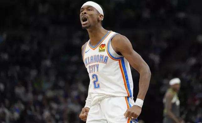 Oklahoma City Thunder guard Shai Gilgeous-Alexander (2) celebrates after making a three-point shot during the second half of an NBA basketball game against the Minnesota Timberwolves, Sunday, Feb. 23, 2025, in Minneapolis. (AP Photo/Abbie Parr)