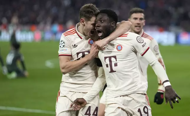 Bayern's Alphonso Davies, centre, celebrates after scoring his side's opening goal during the Champions League playoff second leg soccer match between FC Bayern Munich and Celtic Glasgow at the Allianz Arena in Munich, Germany, Tuesday, Feb. 18, 2025. (AP Photo/Matthias Schrader)