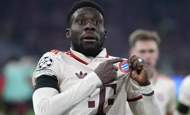 Bayern's Alphonso Davies celebrates after scoring his side's opening goal during the Champions League playoff second leg soccer match between FC Bayern Munich and Celtic Glasgow at the Allianz Arena in Munich, Germany, Tuesday, Feb. 18, 2025. (AP Photo/Matthias Schrader)