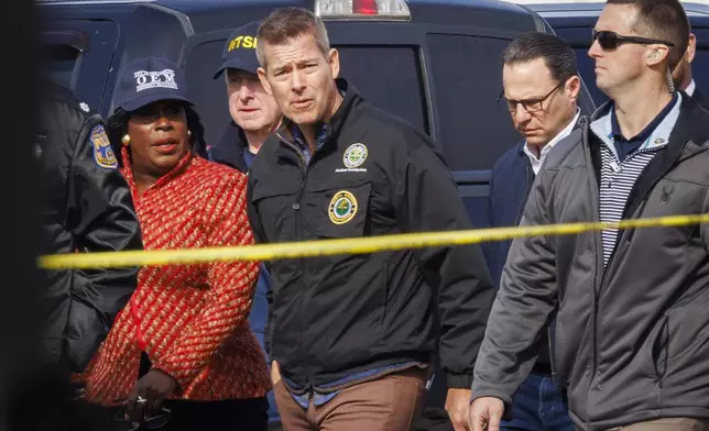 From left; Philadelphia Mayor Cherelle Parker, United States Secretary of Transportation Sean Patrick Duffy, and Pennsylvania Governor Josh Shapiro tour the Friday night crash scene of a medical transport jet Monday morning Feb. 3, 2025, in Philadelphia. (Alejandro A. Alvarez /The Philadelphia Inquirer via AP)